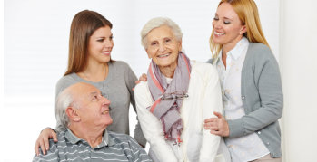 elderly couple and two caregivers